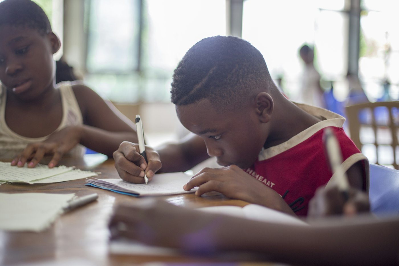 Students writing at their desks